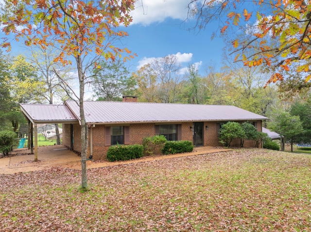 ranch-style home with a carport