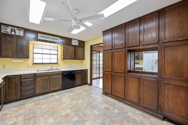 kitchen with white refrigerator with ice dispenser, sink, ceiling fan, black dishwasher, and dark brown cabinets