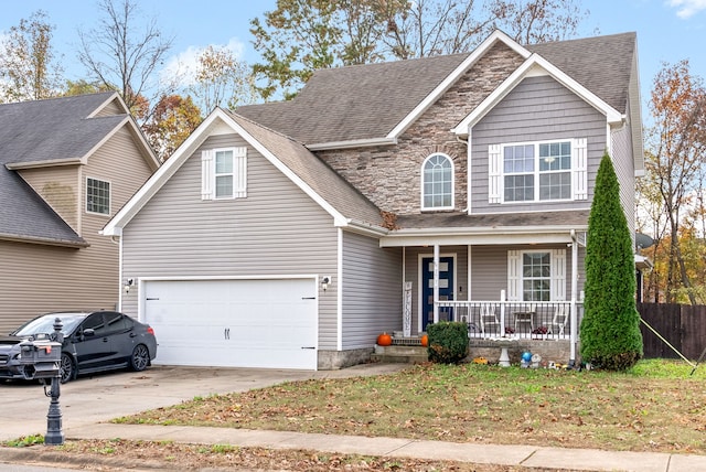 view of front of home featuring a porch and a garage