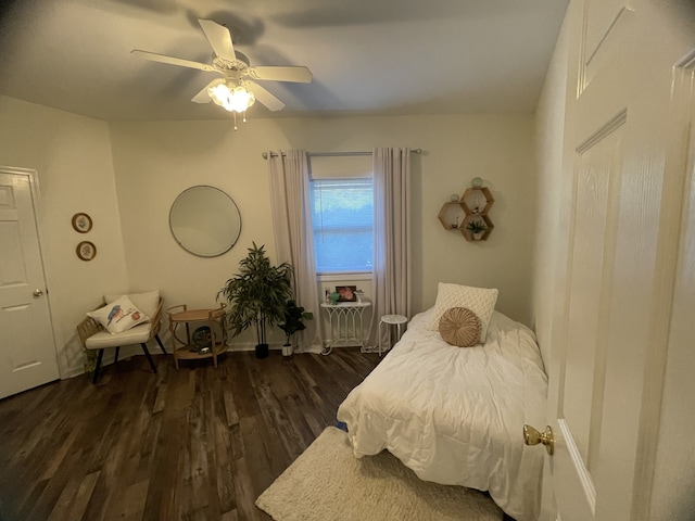 bedroom featuring ceiling fan and dark hardwood / wood-style floors