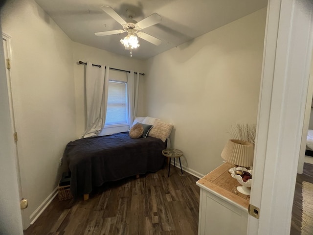 bedroom featuring ceiling fan and dark hardwood / wood-style flooring