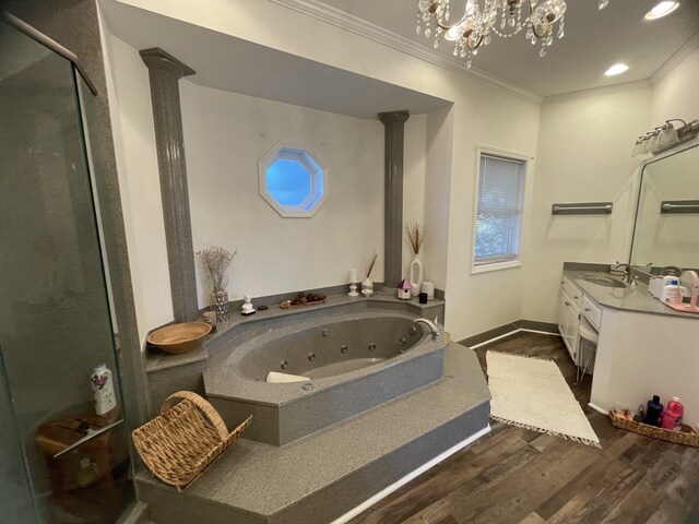 bathroom with vanity, ornamental molding, shower with separate bathtub, and hardwood / wood-style flooring