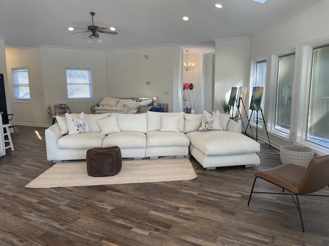 living room featuring crown molding, ceiling fan with notable chandelier, and dark hardwood / wood-style floors