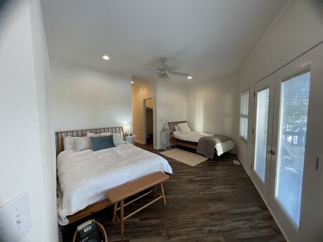 bedroom featuring access to outside, dark hardwood / wood-style floors, ceiling fan, and crown molding