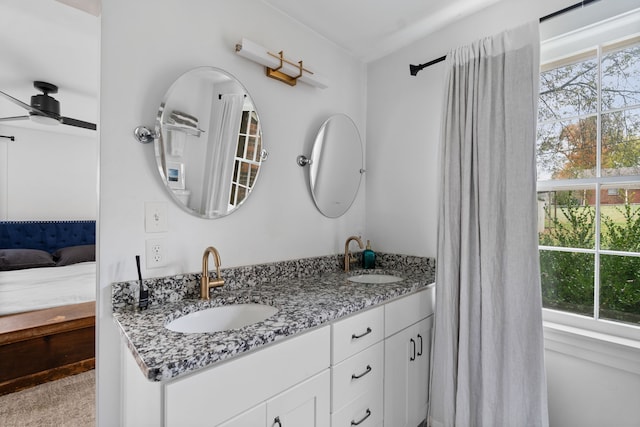 bathroom featuring ceiling fan and vanity