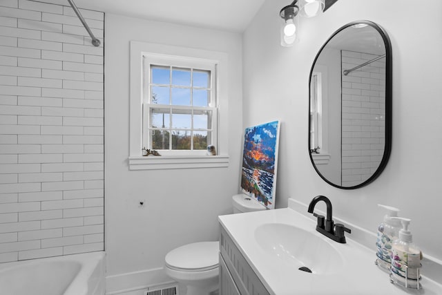 full bathroom featuring vanity, toilet, and tiled shower / bath