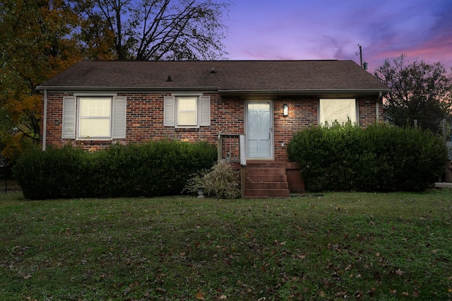 view of front of property with a lawn