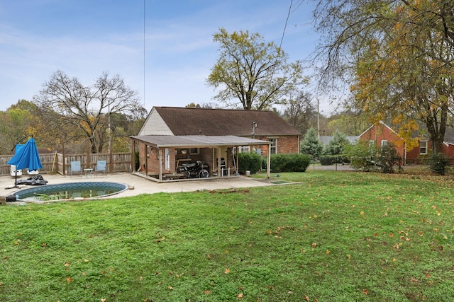 view of yard featuring a fenced in pool and a patio area