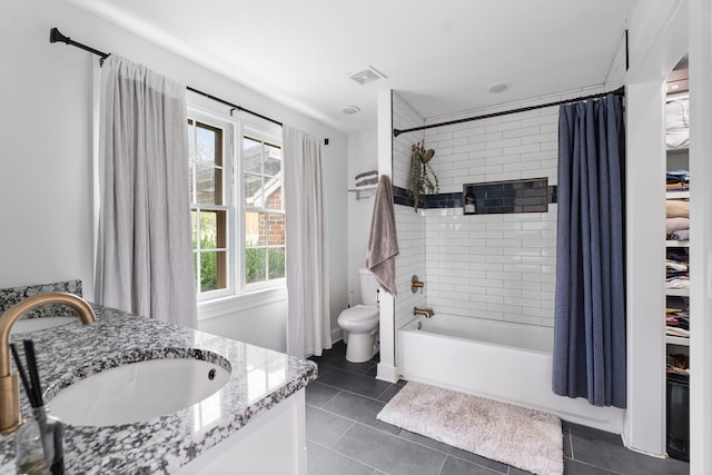 full bathroom with tile patterned flooring, vanity, and plenty of natural light