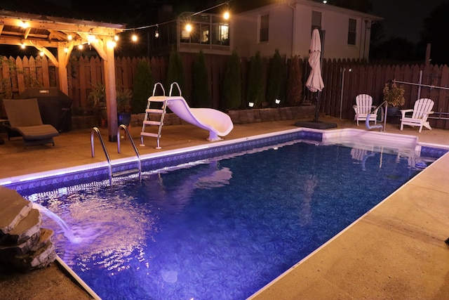 view of pool with a grill, a patio area, a pergola, and a water slide