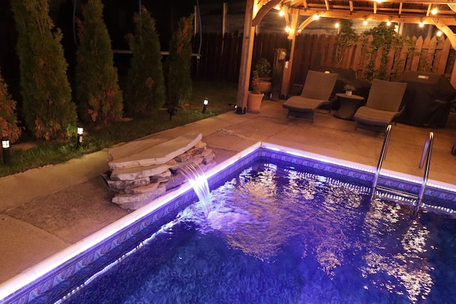 view of swimming pool featuring area for grilling and a patio