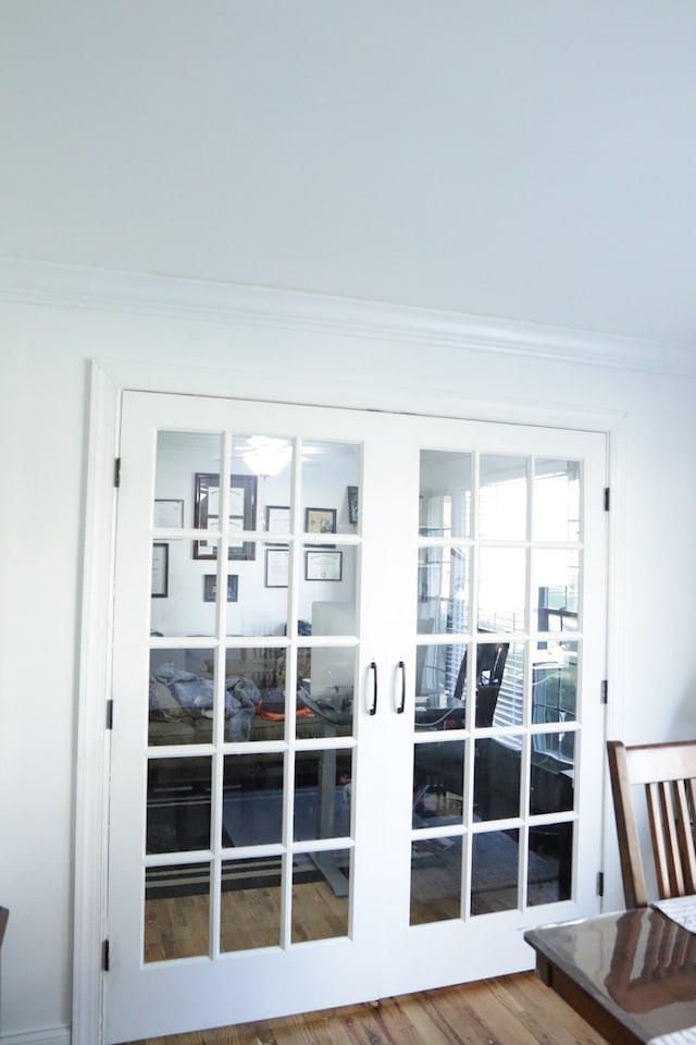 doorway featuring french doors and hardwood / wood-style flooring