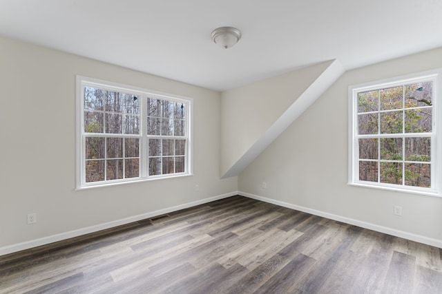 unfurnished room featuring wood-type flooring