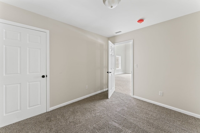 unfurnished bedroom with carpet