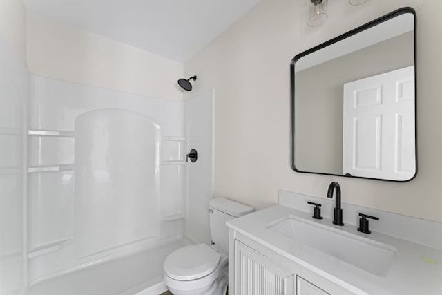 bathroom featuring vanity, toilet, and walk in shower