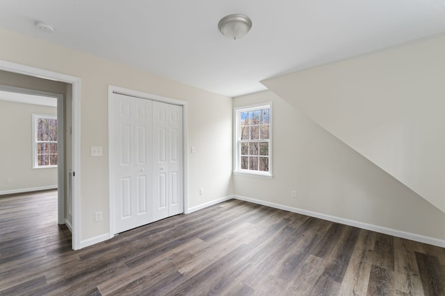 interior space featuring dark hardwood / wood-style flooring and a healthy amount of sunlight