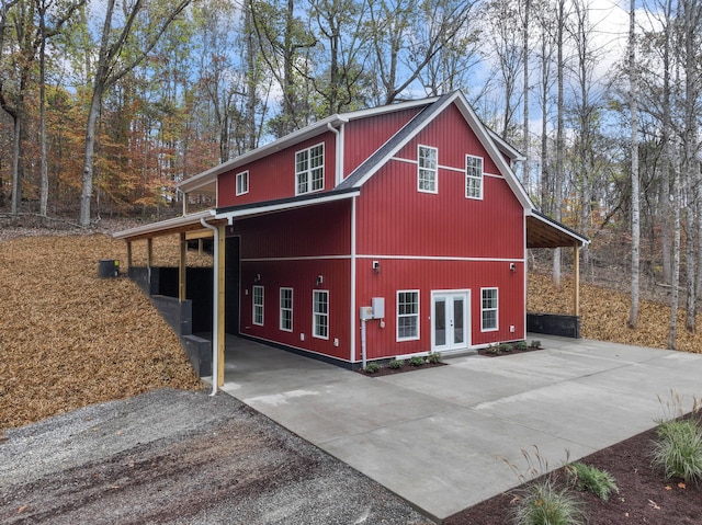 view of side of property featuring french doors