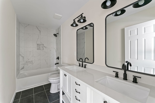 full bathroom featuring tile patterned flooring, vanity, tiled shower / bath combo, and toilet