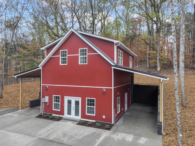 exterior space with french doors and a carport