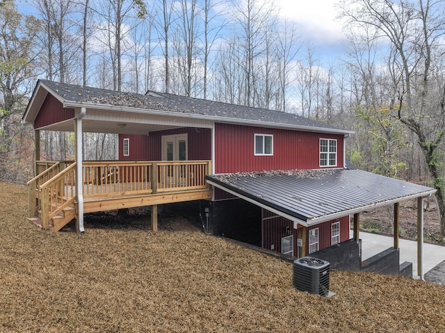 view of front of home with french doors and central air condition unit