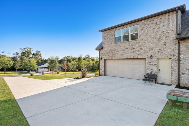 view of side of home with a garage