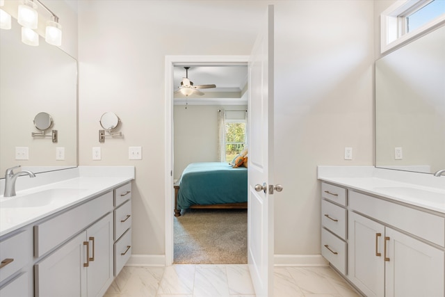 bathroom featuring vanity, a healthy amount of sunlight, and ceiling fan