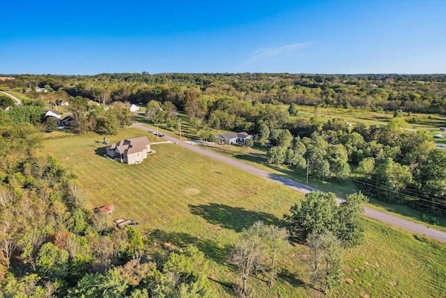 birds eye view of property with a rural view