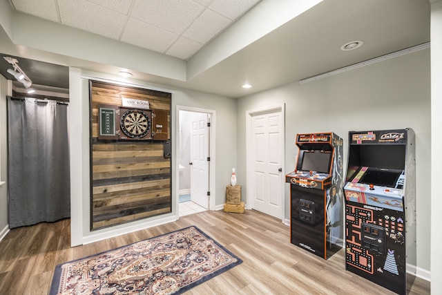 entrance foyer with a drop ceiling and hardwood / wood-style flooring