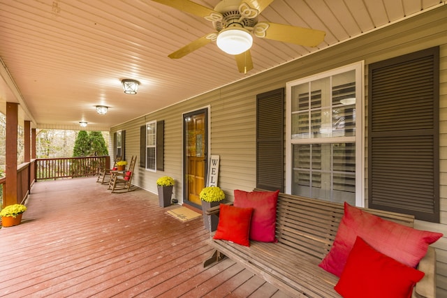 deck with covered porch and ceiling fan