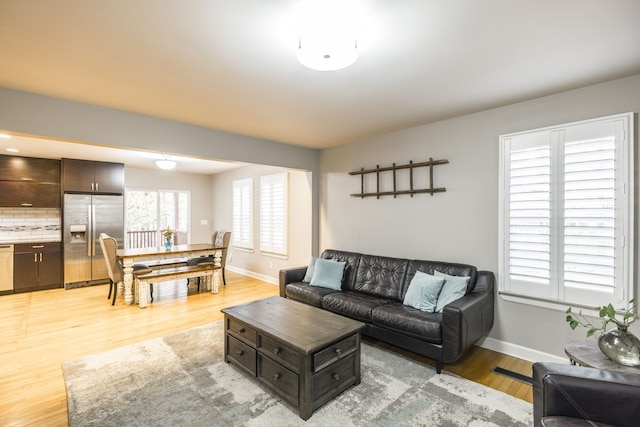 living room with light hardwood / wood-style flooring