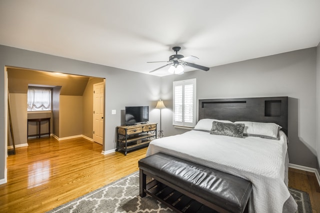 bedroom with ceiling fan and wood-type flooring