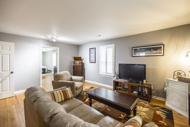 living room featuring light wood-type flooring