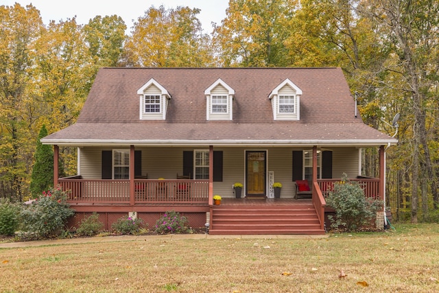 view of front of house with a porch and a front lawn