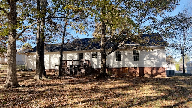 back of house with a deck