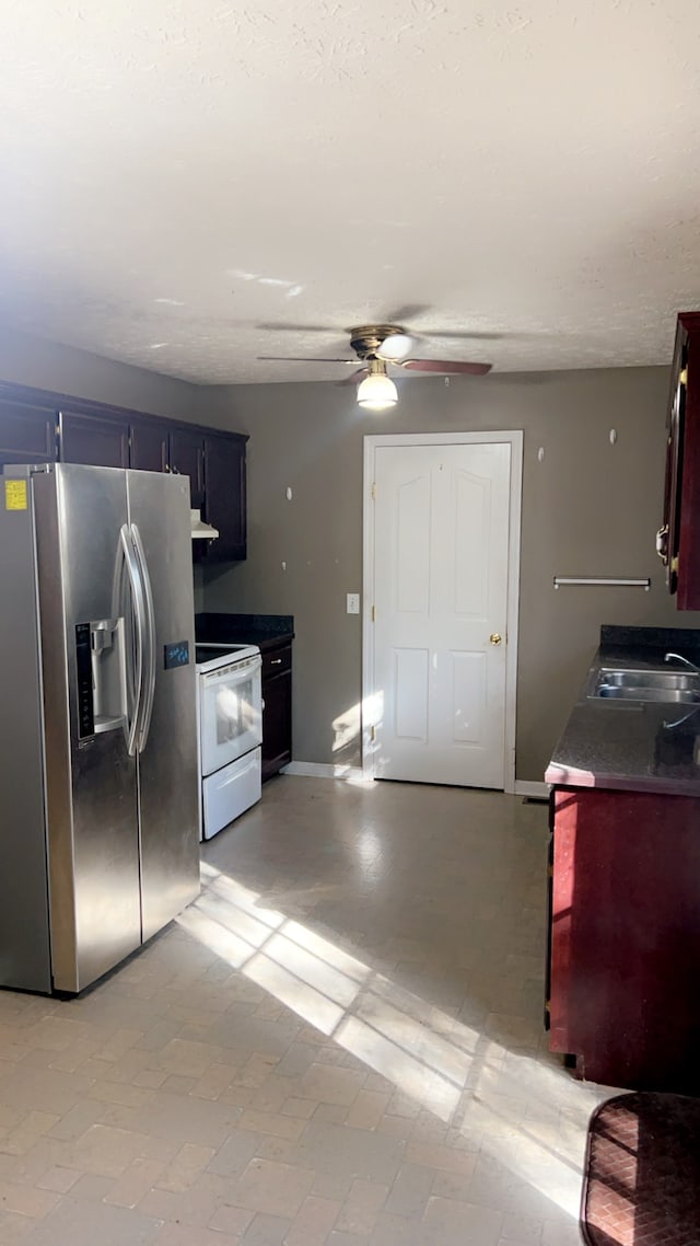 kitchen with ceiling fan, sink, white electric range oven, range hood, and stainless steel refrigerator with ice dispenser