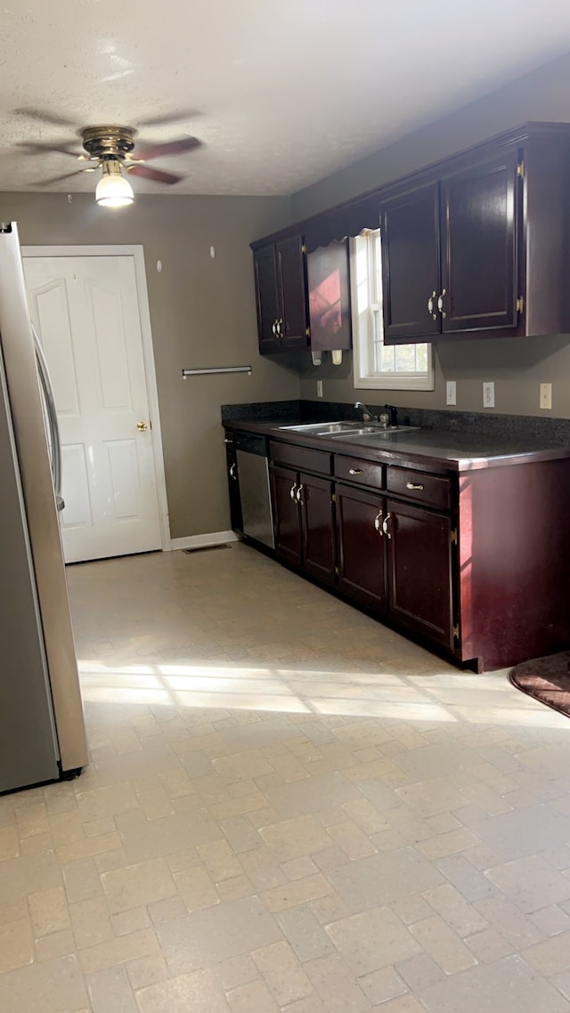 kitchen with ceiling fan, sink, and appliances with stainless steel finishes