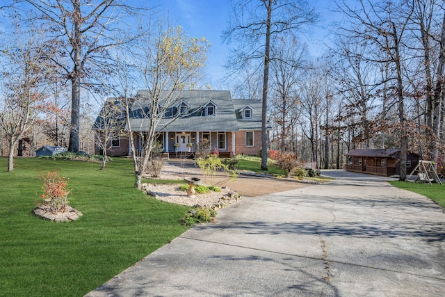 cape cod-style house with a front yard and a porch