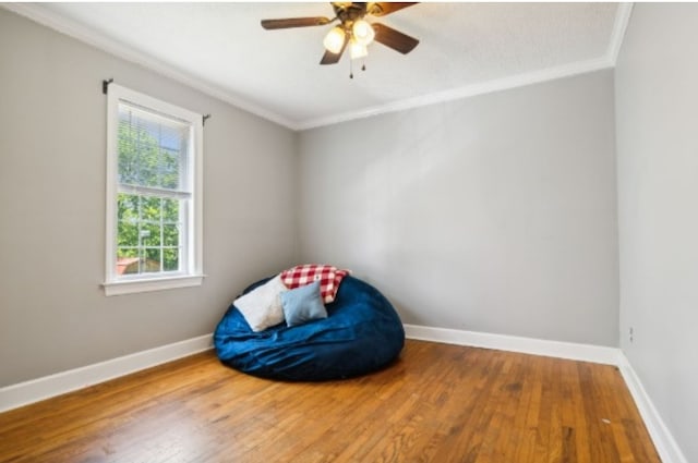 unfurnished room with wood-type flooring, ceiling fan, and crown molding