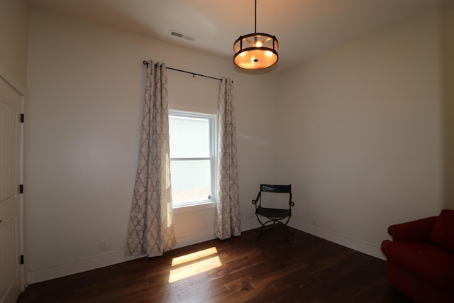 unfurnished room with dark hardwood / wood-style flooring