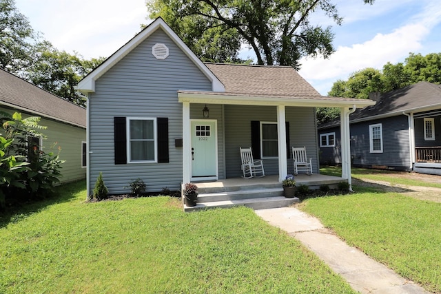 bungalow-style house with a front yard