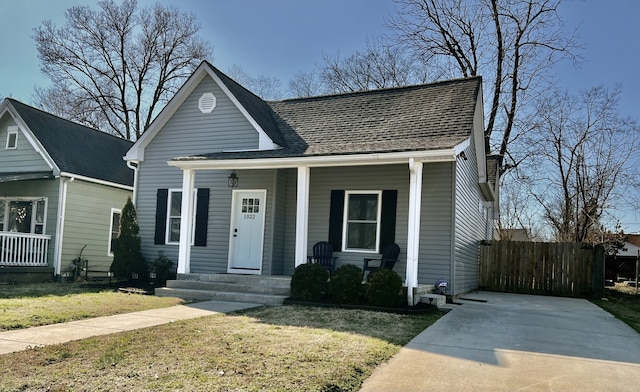 bungalow featuring a front yard