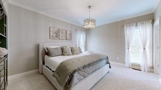 carpeted bedroom featuring crown molding and an inviting chandelier