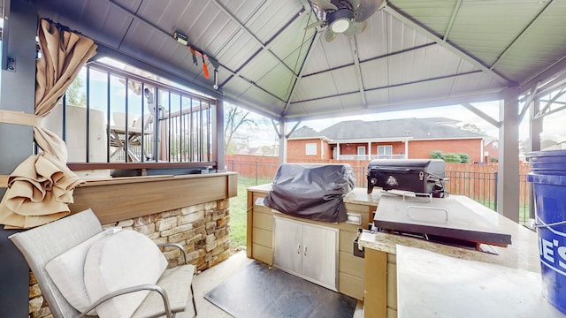 view of patio / terrace featuring a gazebo, area for grilling, and a grill