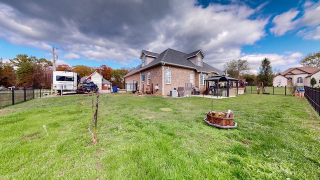 view of yard with a gazebo, cooling unit, and a patio