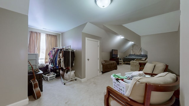 interior space featuring light colored carpet and vaulted ceiling