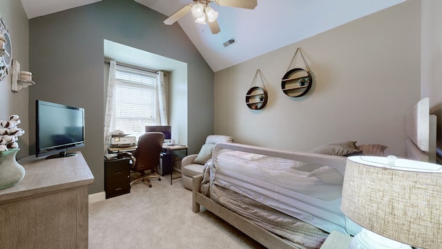 bedroom with ceiling fan, light carpet, and vaulted ceiling