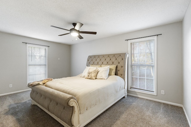 bedroom featuring ceiling fan, carpet floors, and a textured ceiling