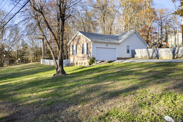 view of property exterior with a garage and a yard