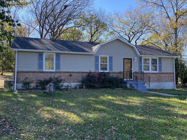 ranch-style house featuring a front lawn