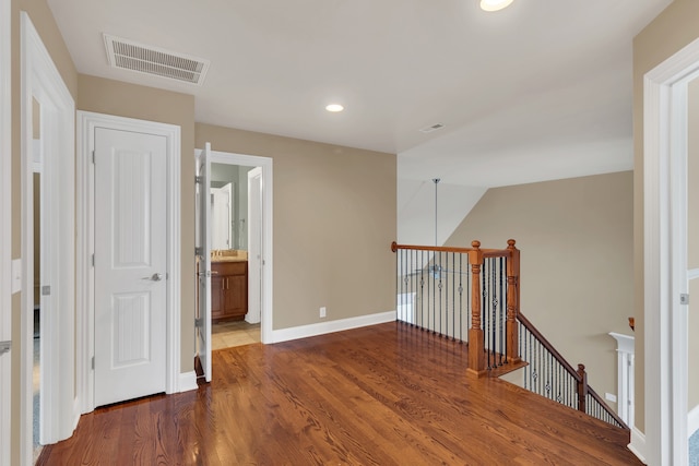 corridor with dark wood-type flooring